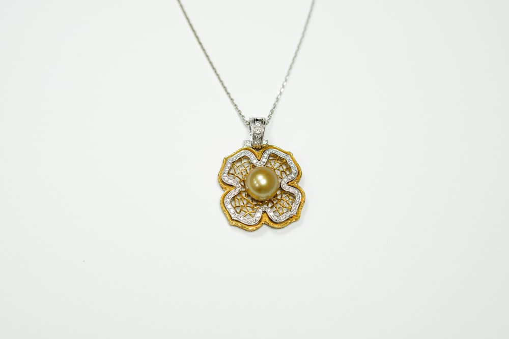 gold and silver heart pendant necklace