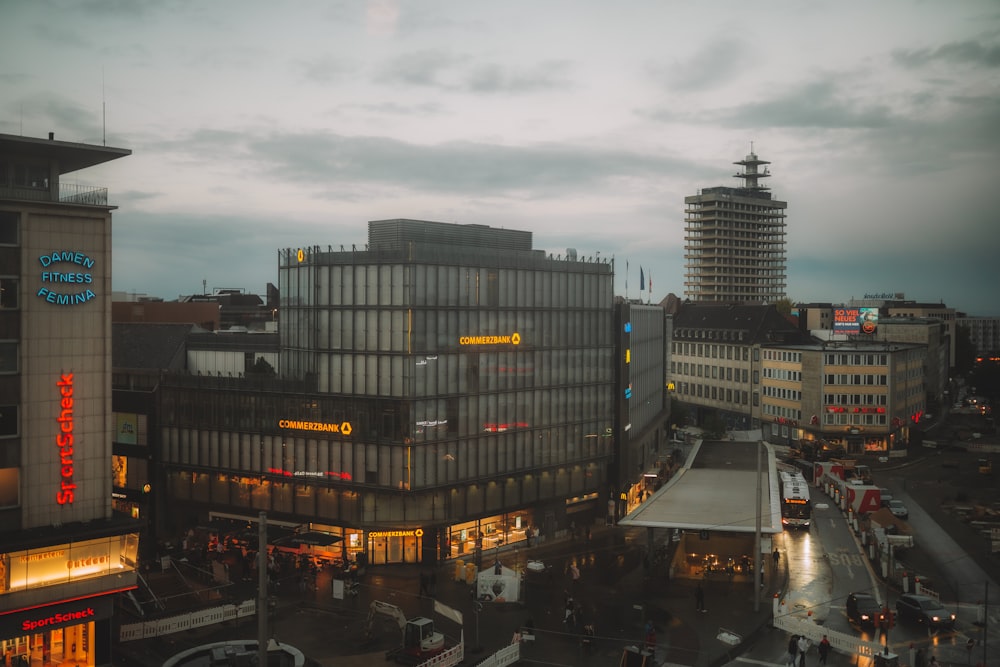 city buildings under gray sky during night time