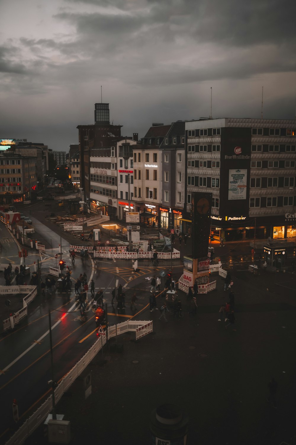 cars on road near buildings during night time