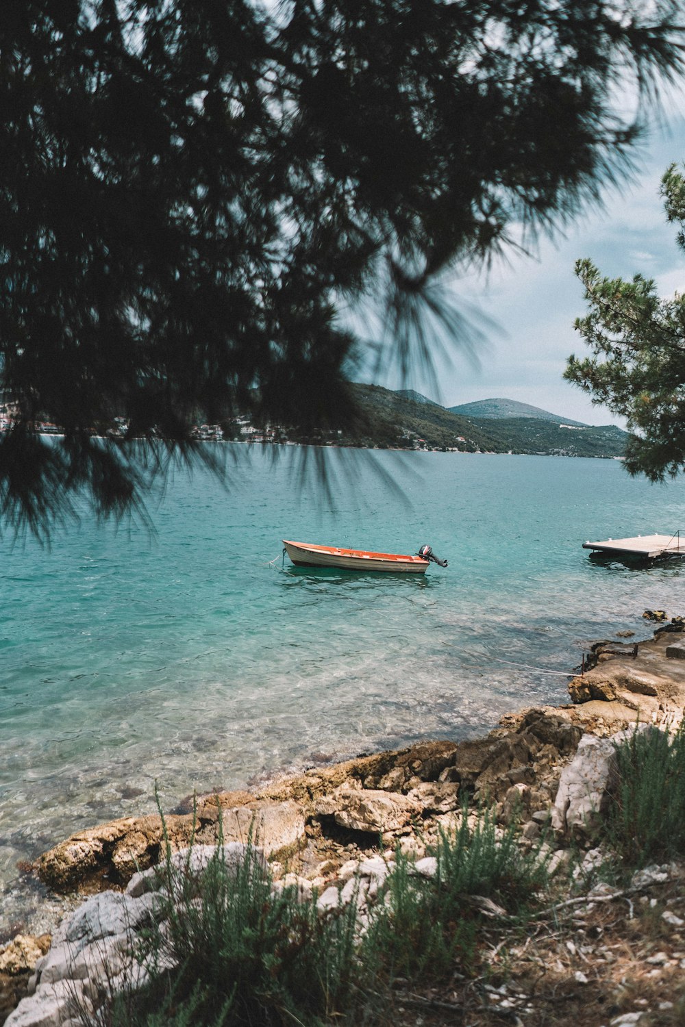 brown boat on body of water during daytime