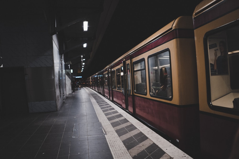 red and white train in train station