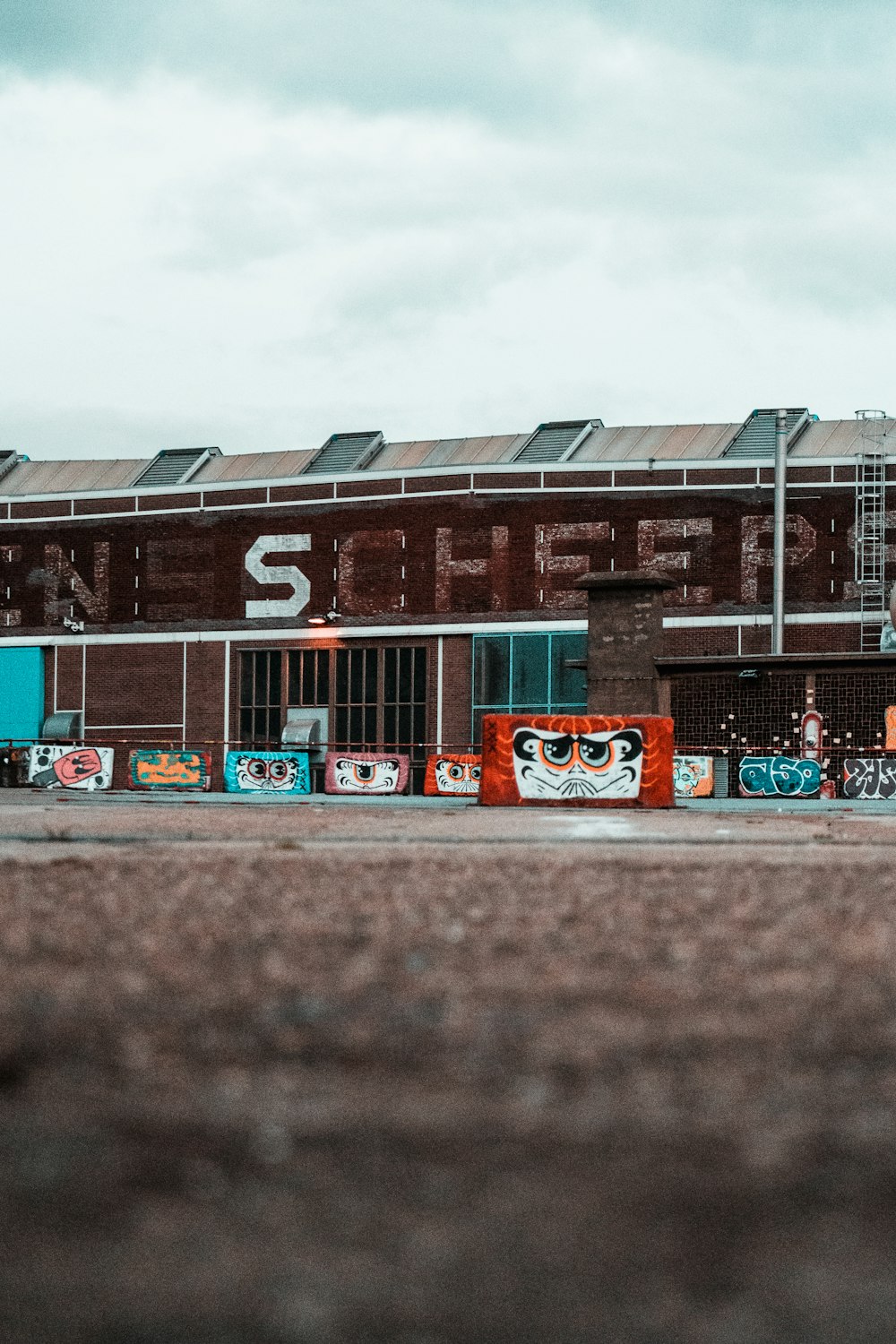 cars parked in front of brown building during daytime