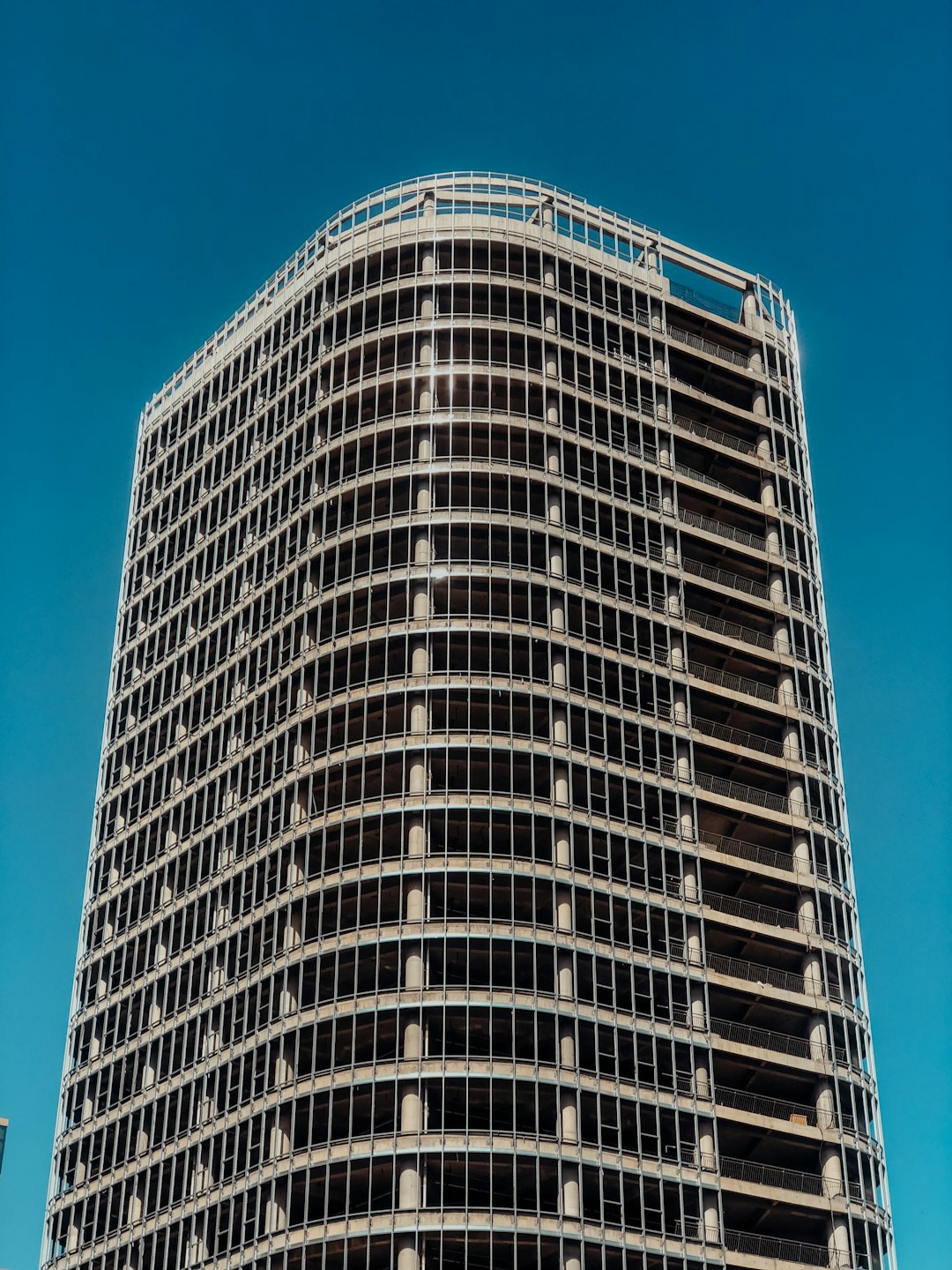 white and black concrete building under blue sky during daytime