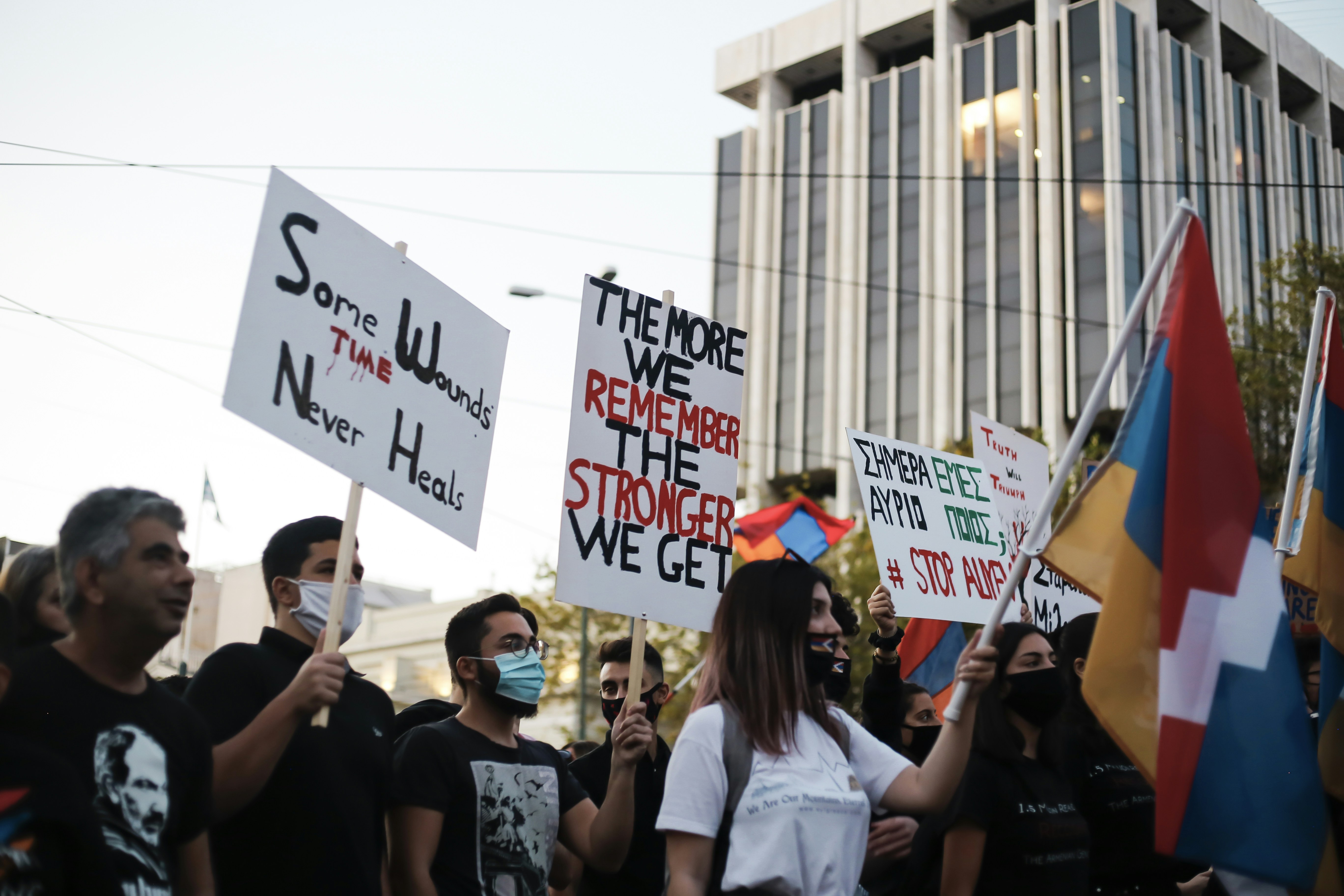 people holding white and blue banner during daytime