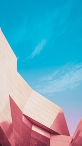 Modern architectural building under clear sky showcasing innovative design.
