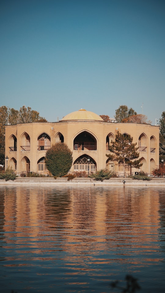 brown concrete building near body of water during daytime in Tabriz Iran