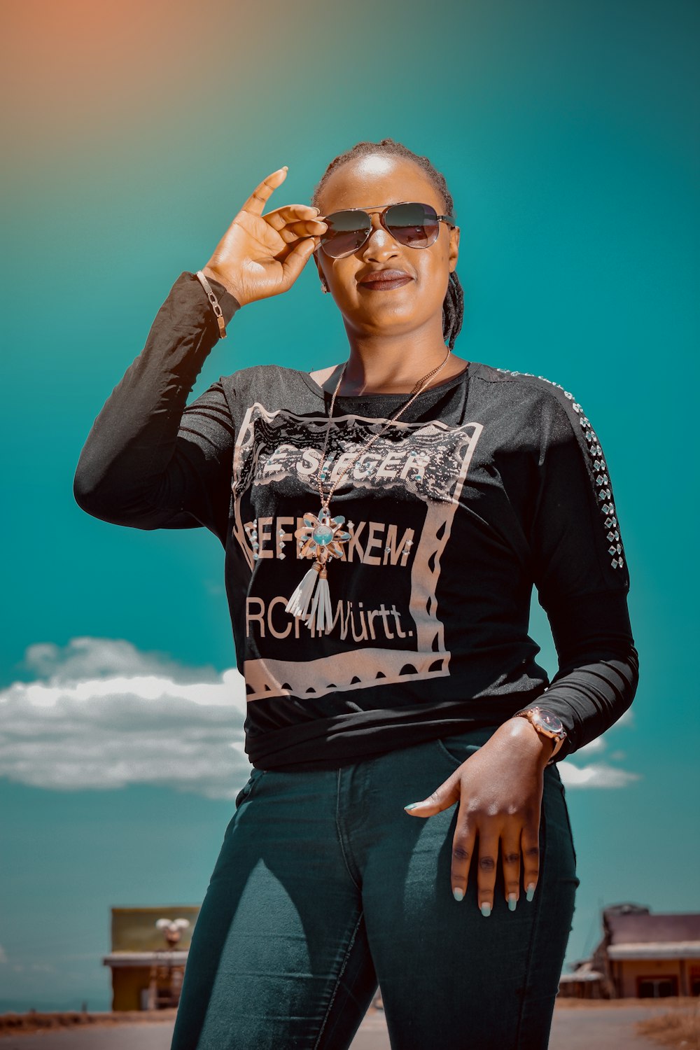 woman in black and white long sleeve shirt wearing sunglasses