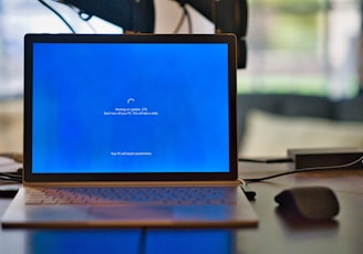 macbook pro on brown wooden table