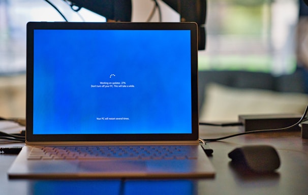 macbook pro on brown wooden table