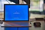 macbook pro on brown wooden table
