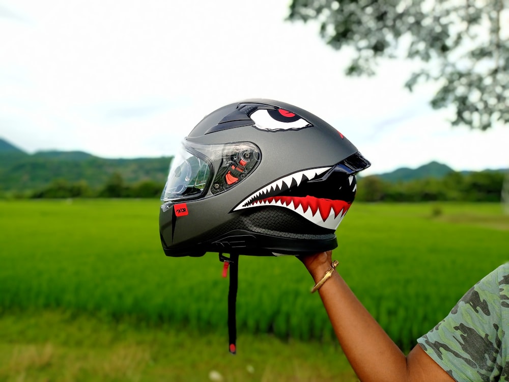 black and white helmet on black metal stand