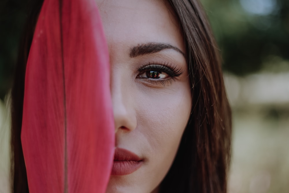 woman with red hair and black eyes