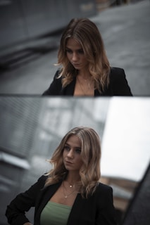 woman in black blazer smiling