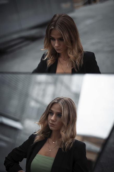 woman in black blazer smiling