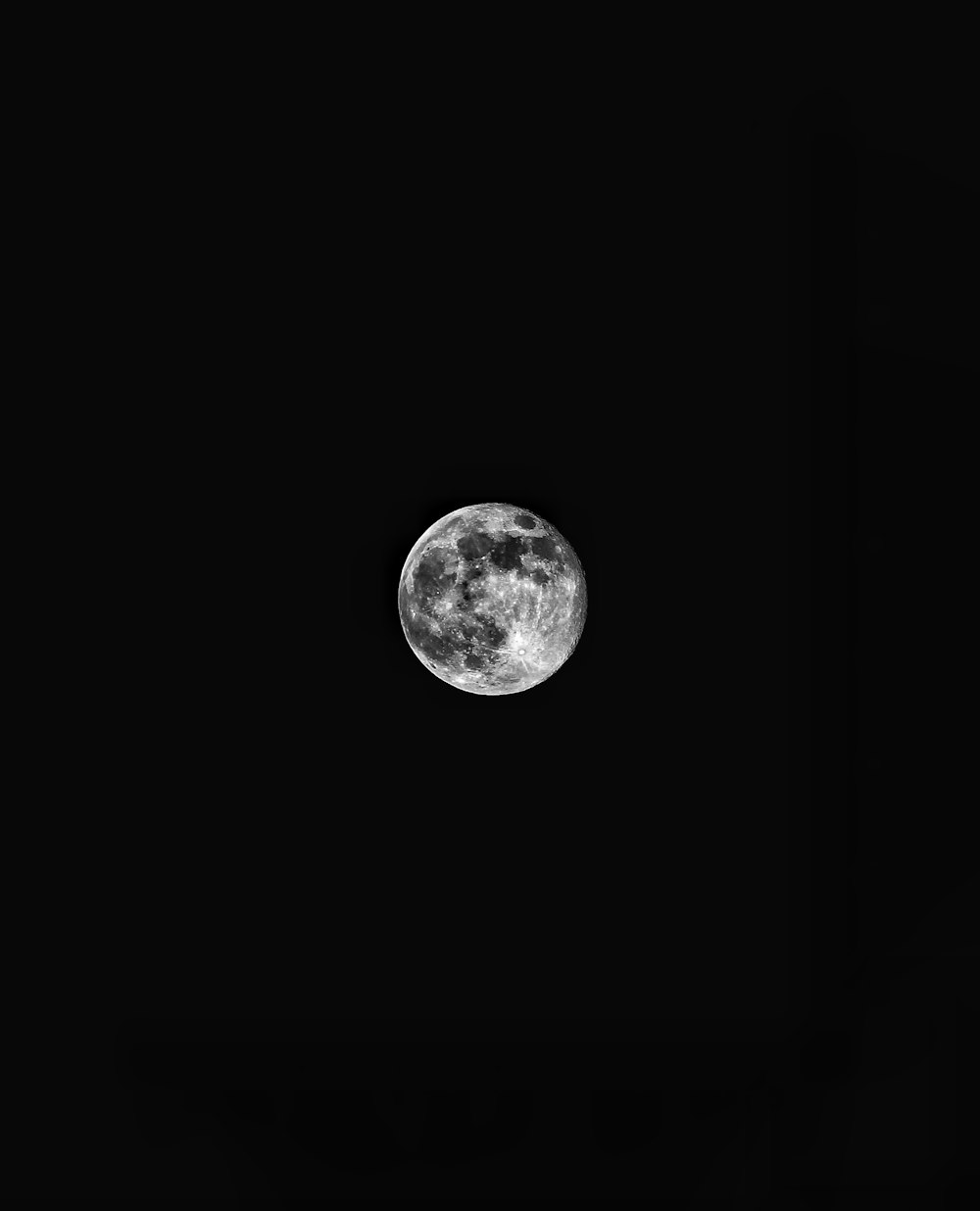 full moon in dark night sky