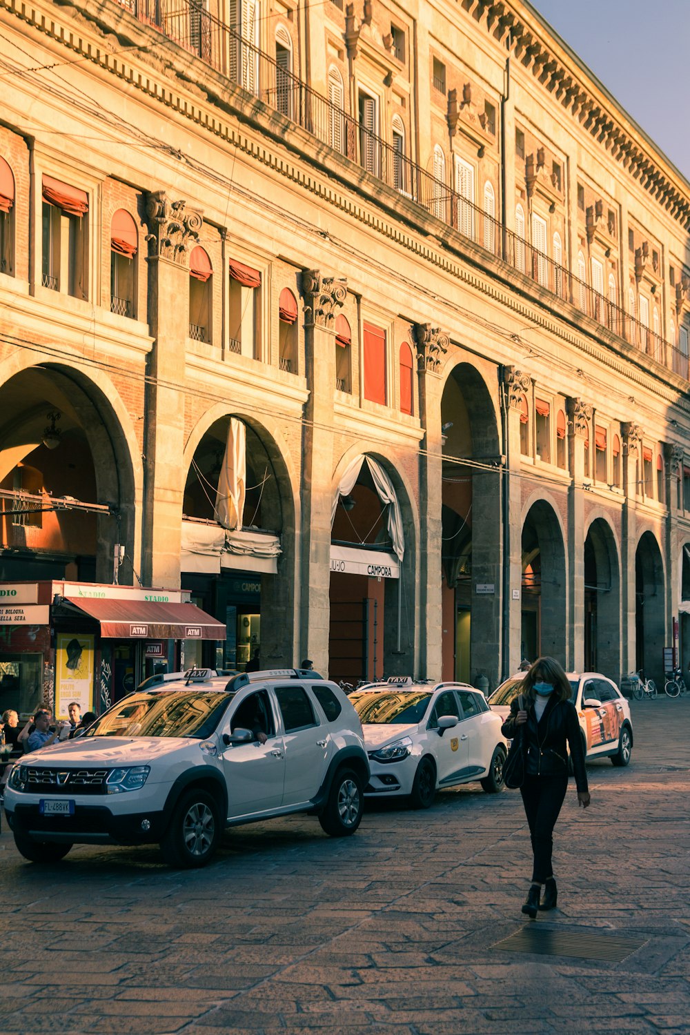 cars parked in front of building during daytime