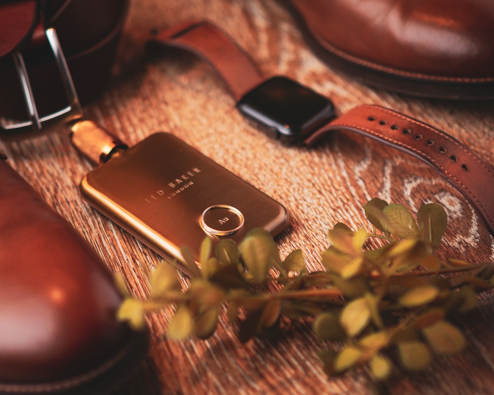 black samsung smartphone on brown wooden table