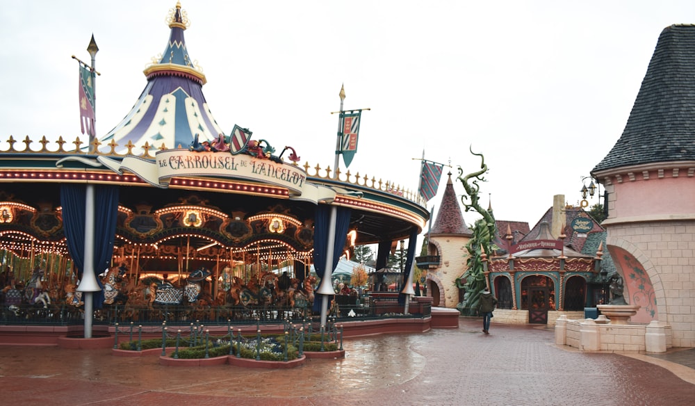 white and brown carousel under white sky during daytime