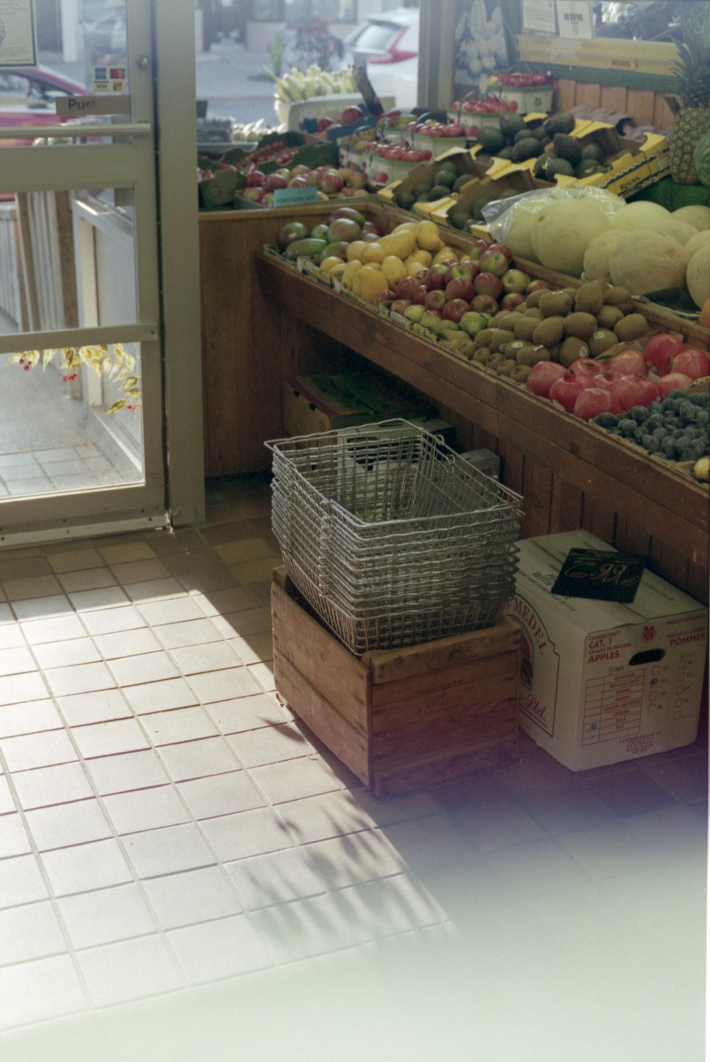 brown woven basket near green and red apples