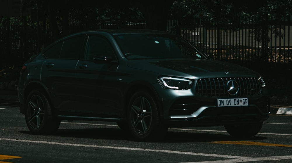 black audi coupe on road during daytime