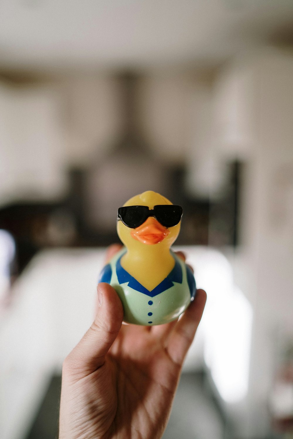 person holding green and yellow plastic toy