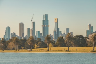 city skyline across body of water during daytime