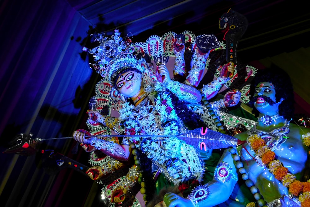 hindu deity figurine on blue table