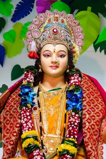woman in red and gold sari
