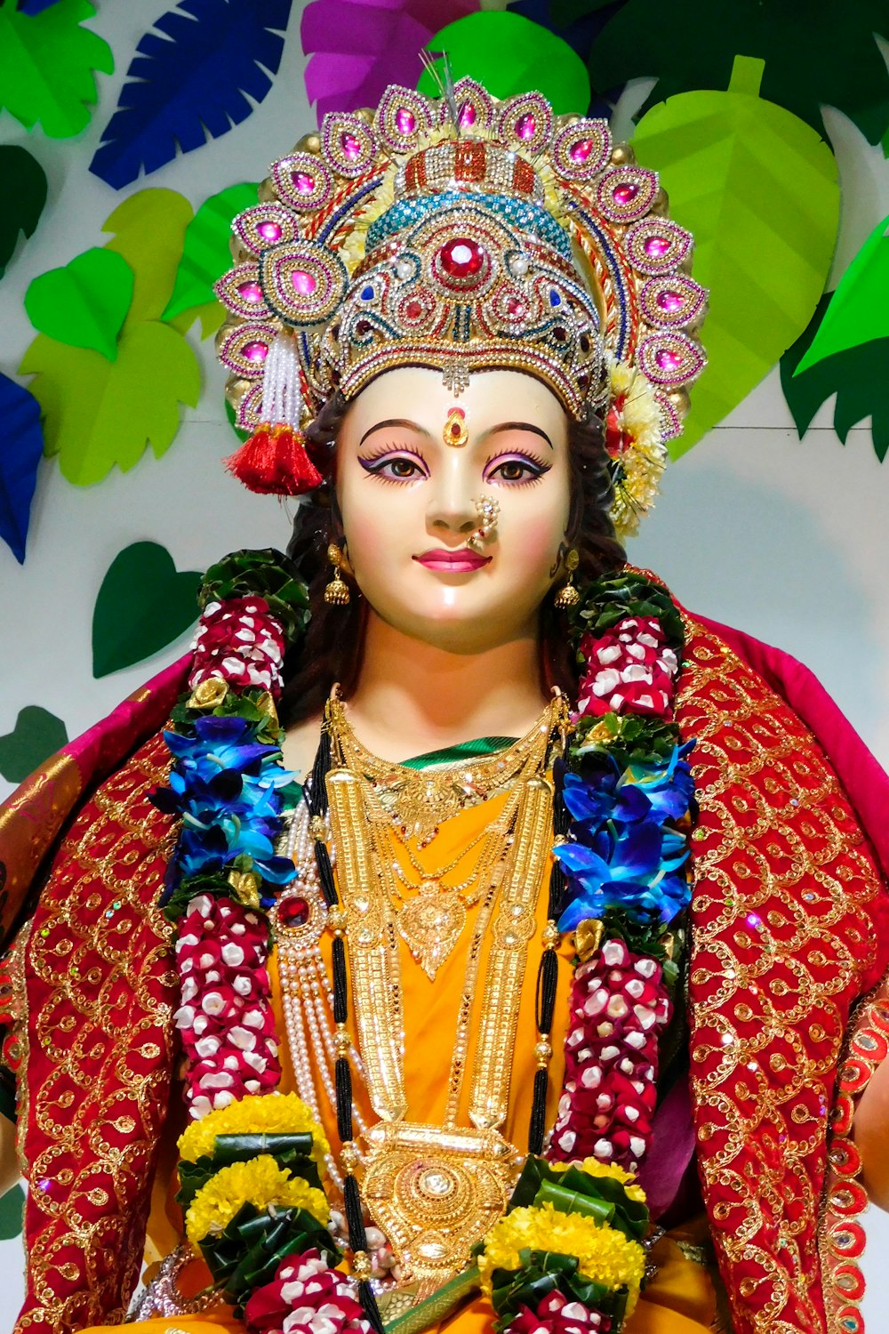 woman in red and gold sari