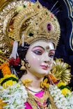 gold and white hindu deity figurine