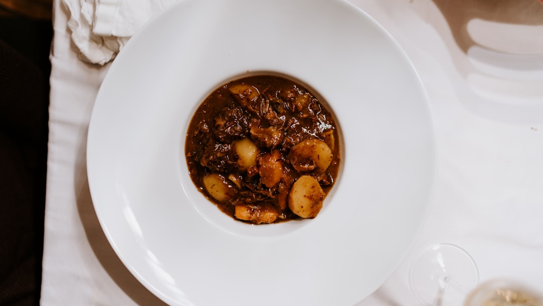 brown and black dish on white ceramic plate