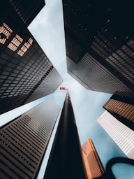 worms eye view of high rise buildings during daytime
