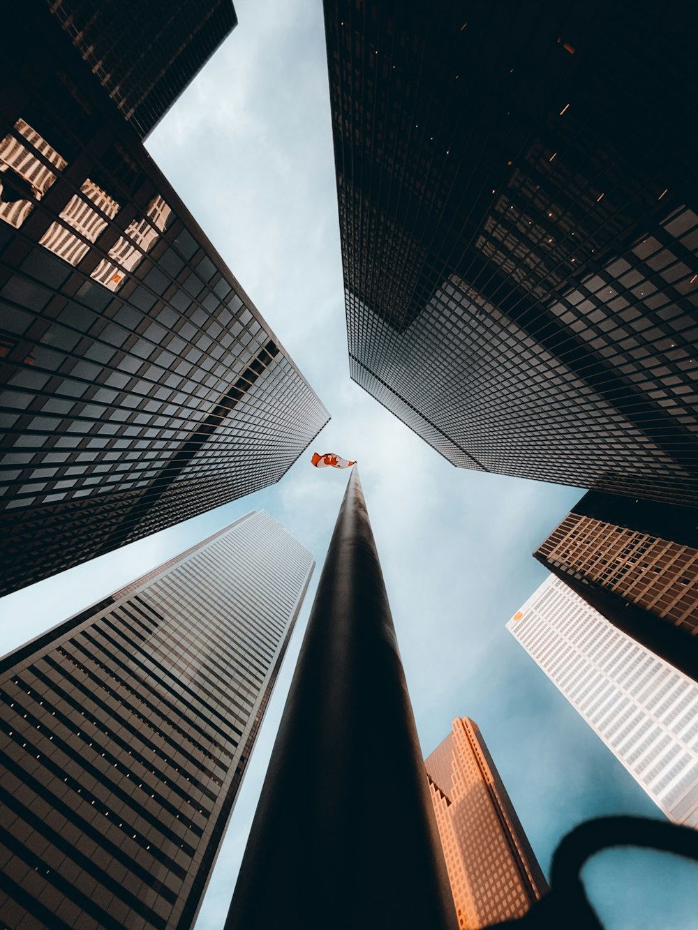 worms eye view of high rise buildings during daytime