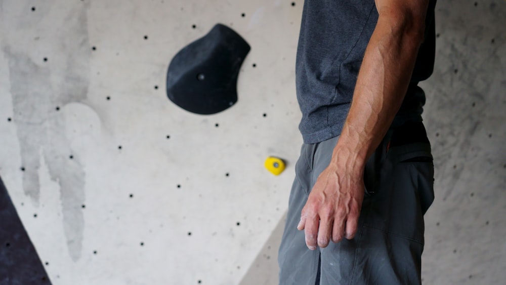 person in blue denim jeans sitting on white floor