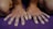Close-up of hands holding a yoga mat, symbolizing personal care and dedication.
