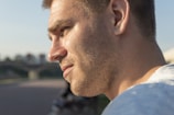 Side profile of a man looking thoughtfully into the distance
