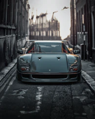 black porsche 911 parked on sidewalk during daytime