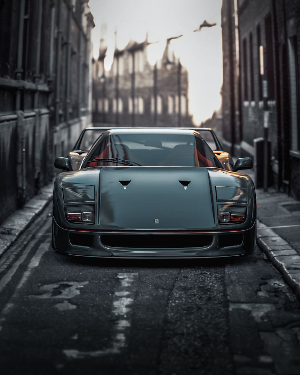 black porsche 911 parked on sidewalk during daytime