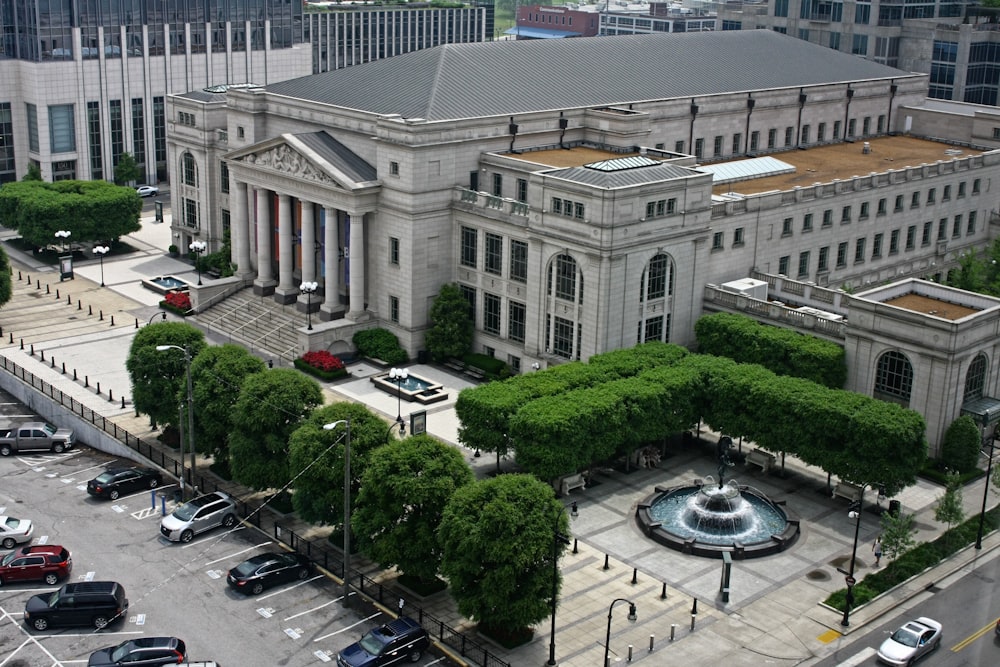 cars parked in front of white building during daytime