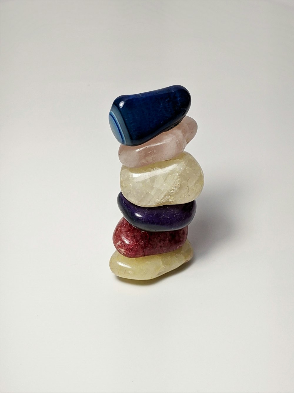yellow blue and red ceramic figurine