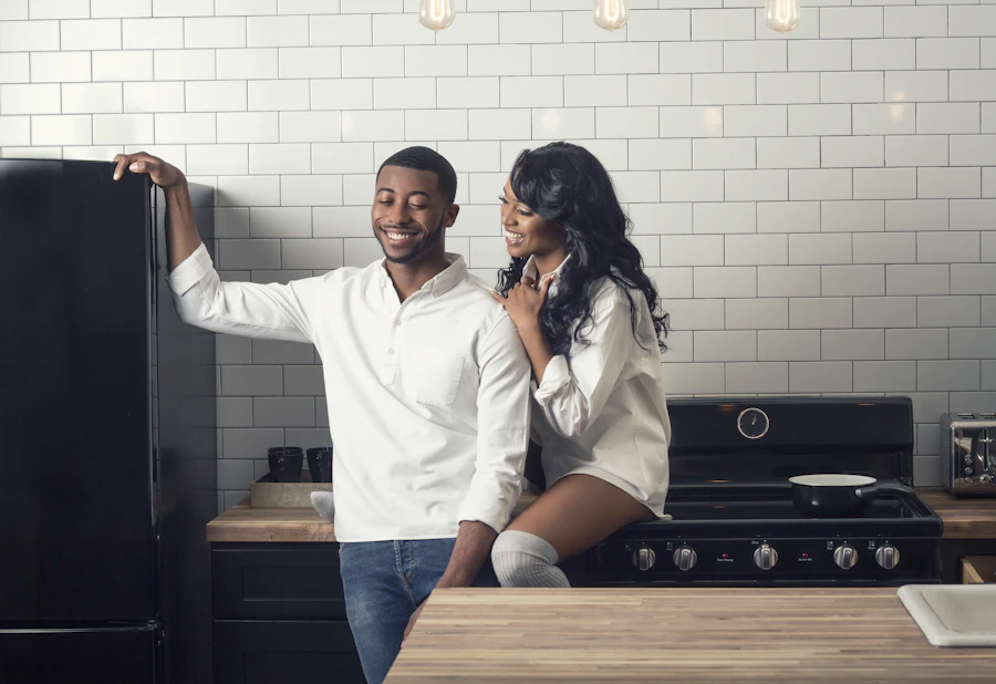 A couple at home in their kitchen