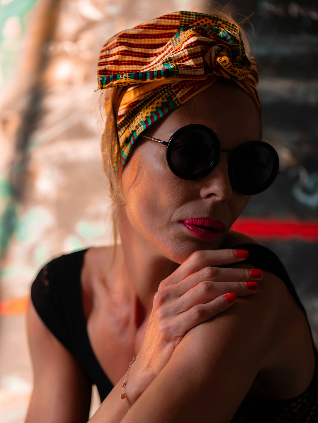 woman in black tank top wearing black sunglasses