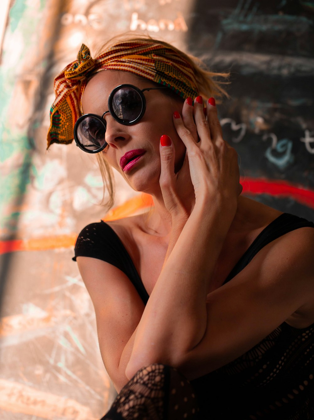 woman in black tank top wearing sunglasses