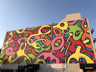 An interactive digital mural displayed on a large wall in Los Angeles