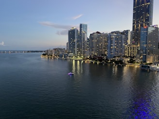 city skyline across body of water during daytime