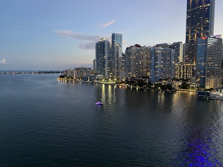 city skyline across body of water during daytime