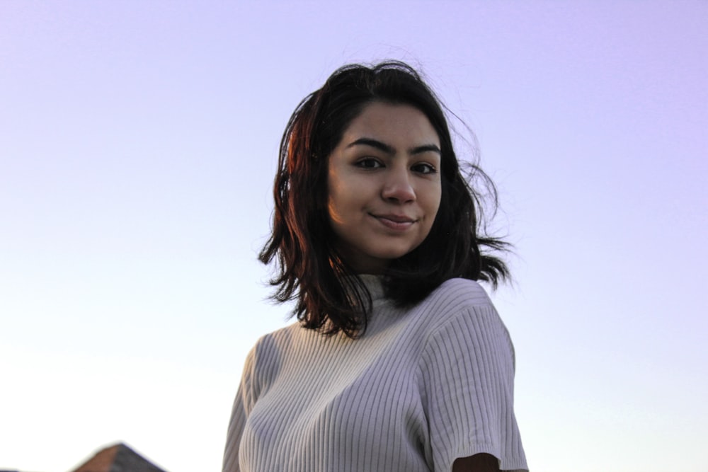 woman in white long sleeve shirt