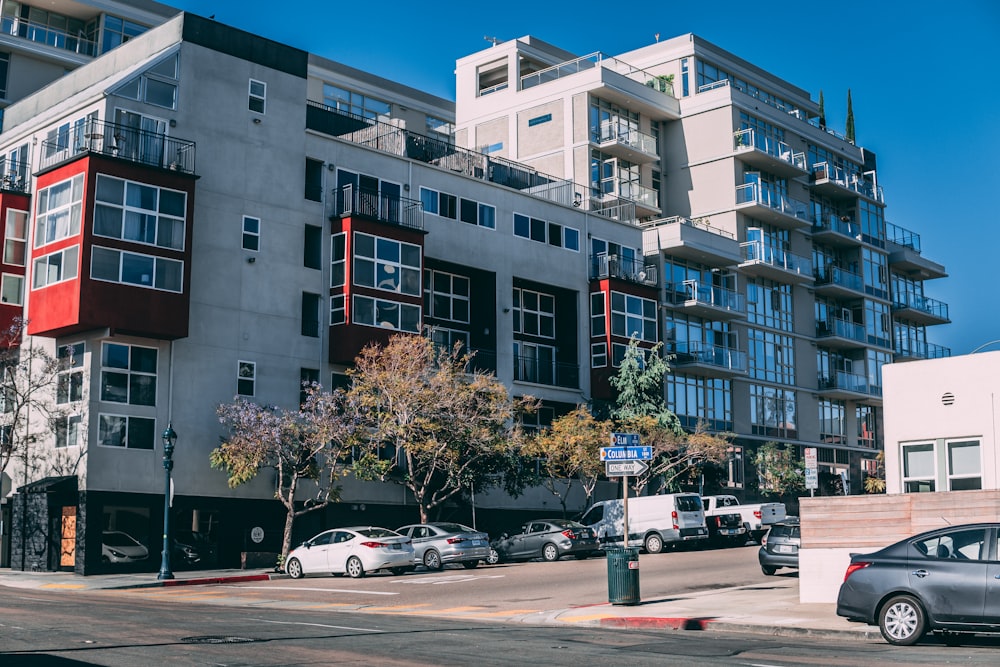 cars parked in front of building during daytime