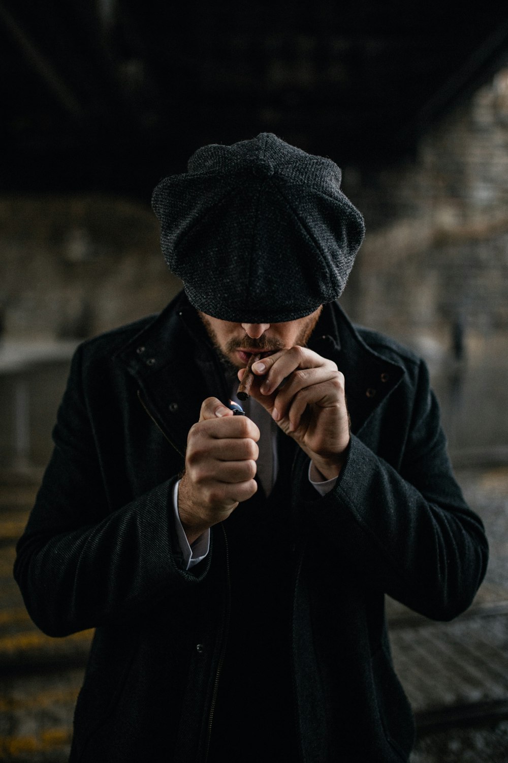 man in black knit cap smoking cigarette