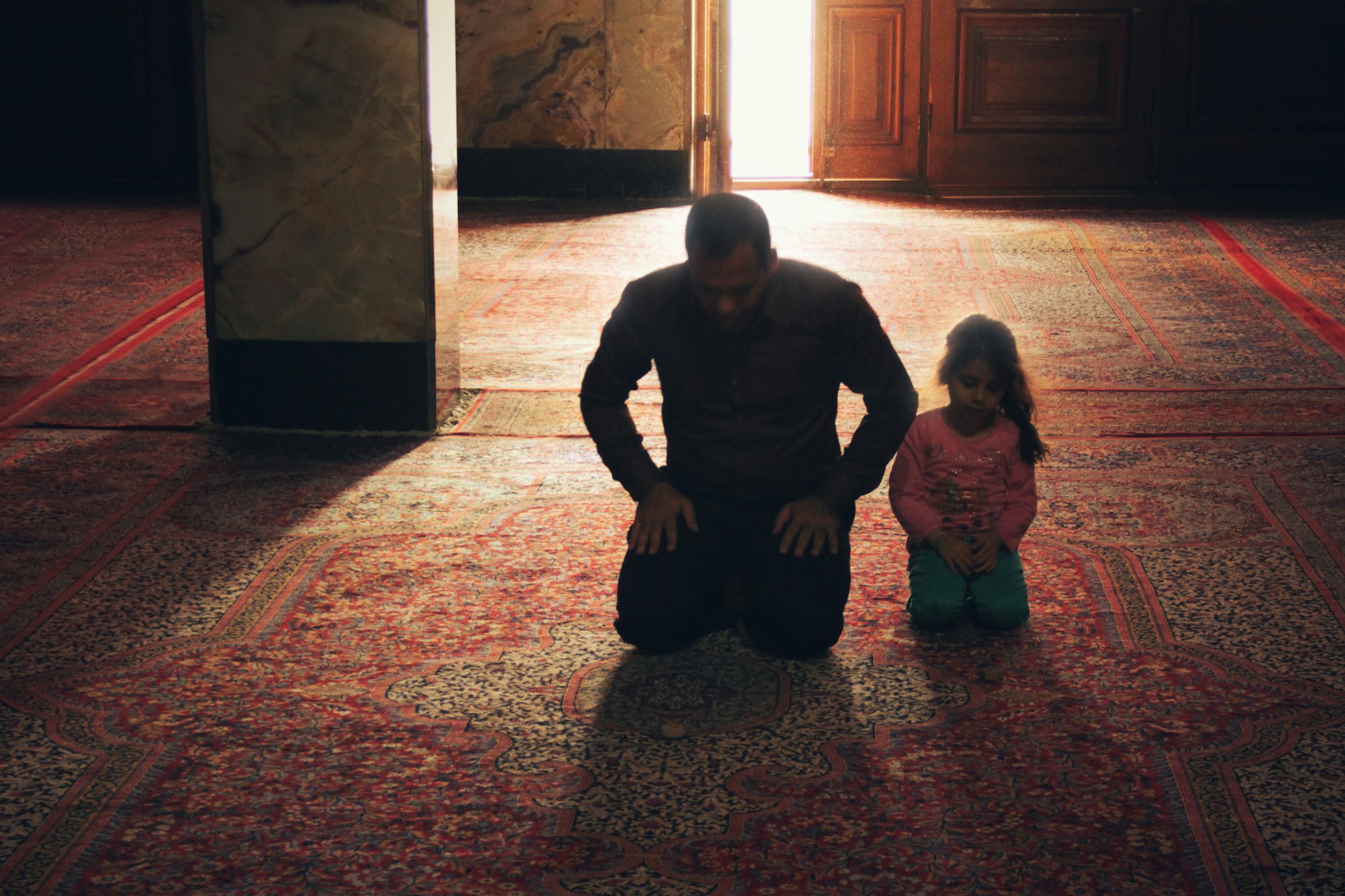 A Father and his Daughter Praying in a Mosque in Yazd, Iran